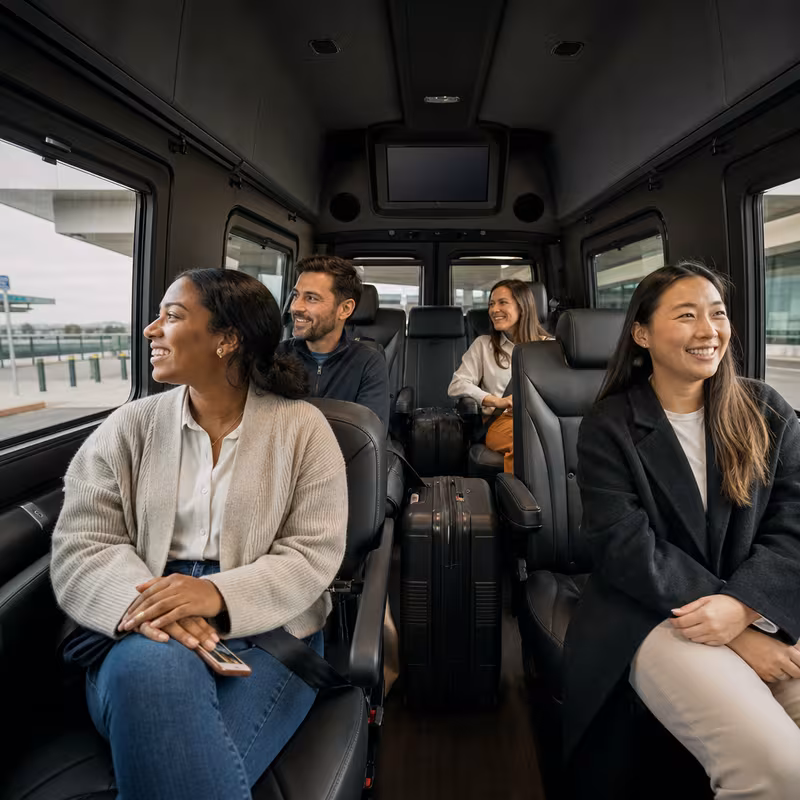 Passengers loading luggage while boarding an Norfolk group shuttle