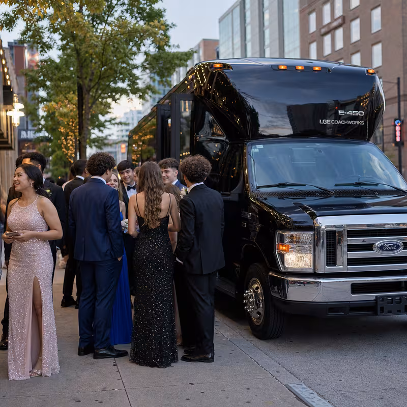 Passengers loading luggage while boarding an Norfolk group shuttle