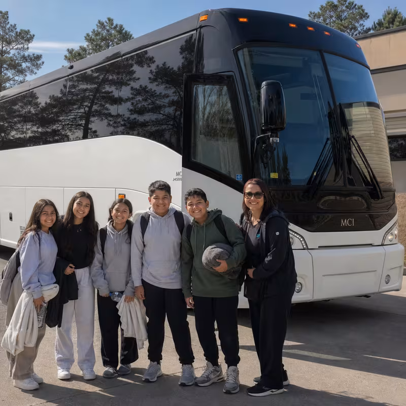 Passengers loading luggage while boarding an Norfolk group shuttle