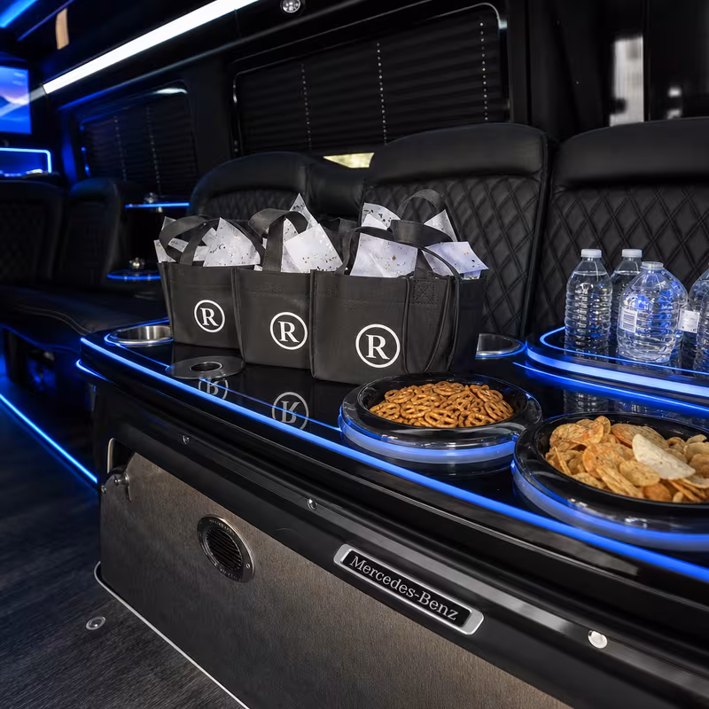 Party bus interior with wraparound leather seating and LED lighting in Norfolk